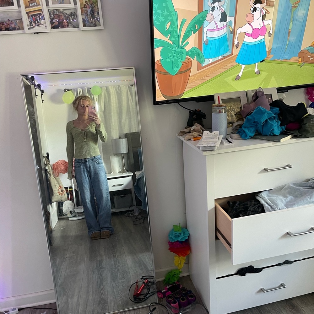 Green Long-Sleeve Top and Blue Jeans